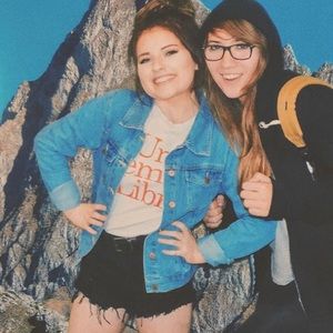 High-waisted distressed black denim shorts